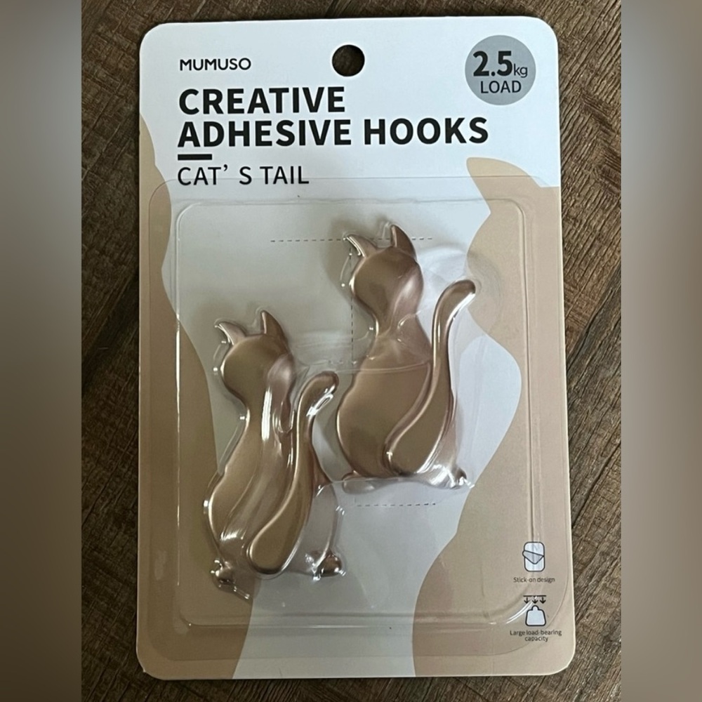 Creative adhesive Cat’s tail hooks. 2 in the pack. New with tags.